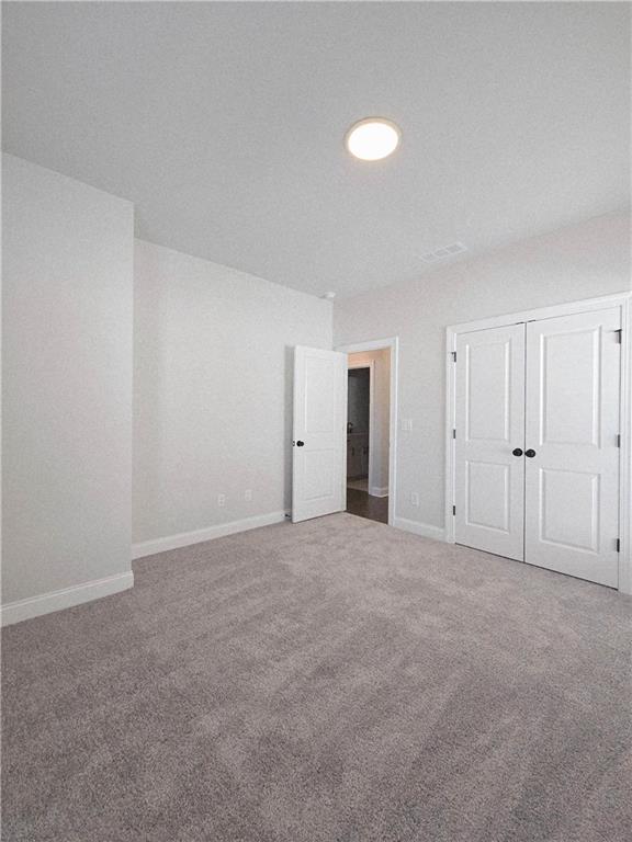 163 Basil Street Cumming, GA 30040 - Photo 44 of 56 a view of an empty room