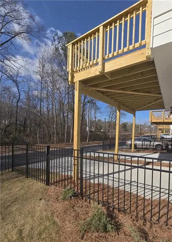 an aerial view of a house with garden space and street view