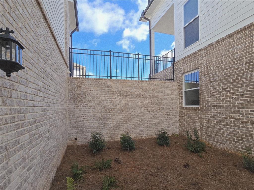 163 Basil Street Cumming, GA 30040 - Photo 49 of 56 a view of a brick wall
