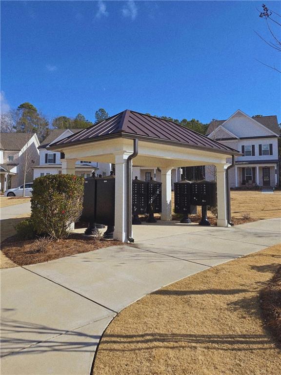 163 Basil Street Cumming, GA 30040 - Photo 51 of 56 front view of a house with a patio