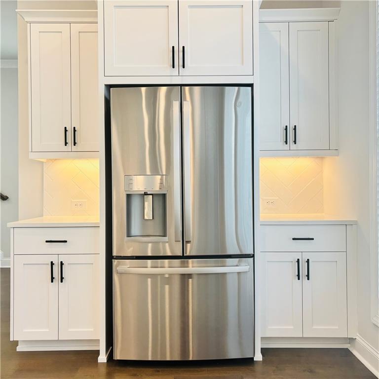163 Basil Street Cumming, GA 30040 - Photo 10 of 56 a view of front door with wooden floor