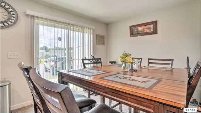 a view of a dining room with furniture window and outside view