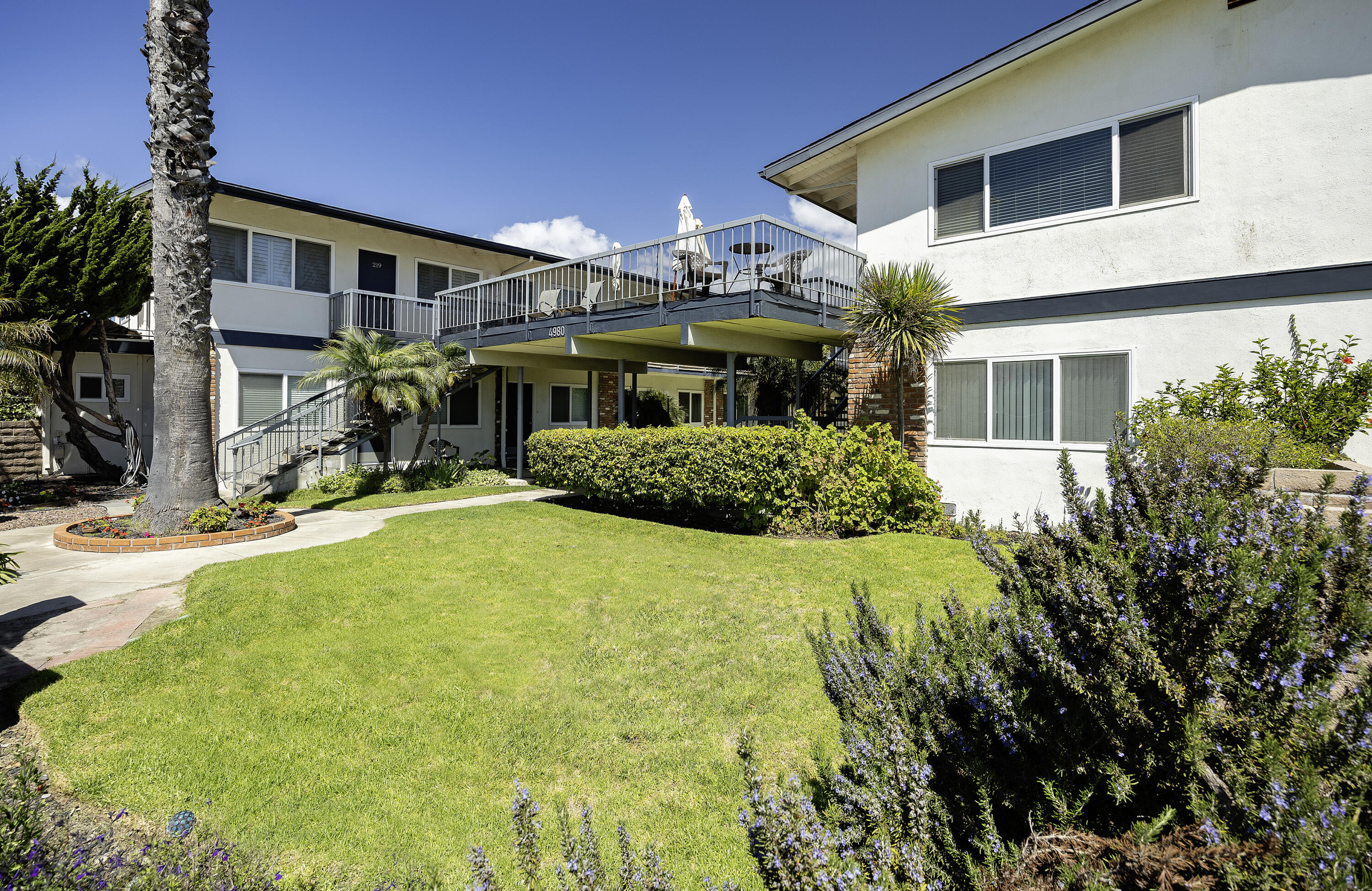 4980 Sandyland Road, Unit 203 Carpinteria, CA 93013 - Photo 11 of 23 a front view of a house with a yard