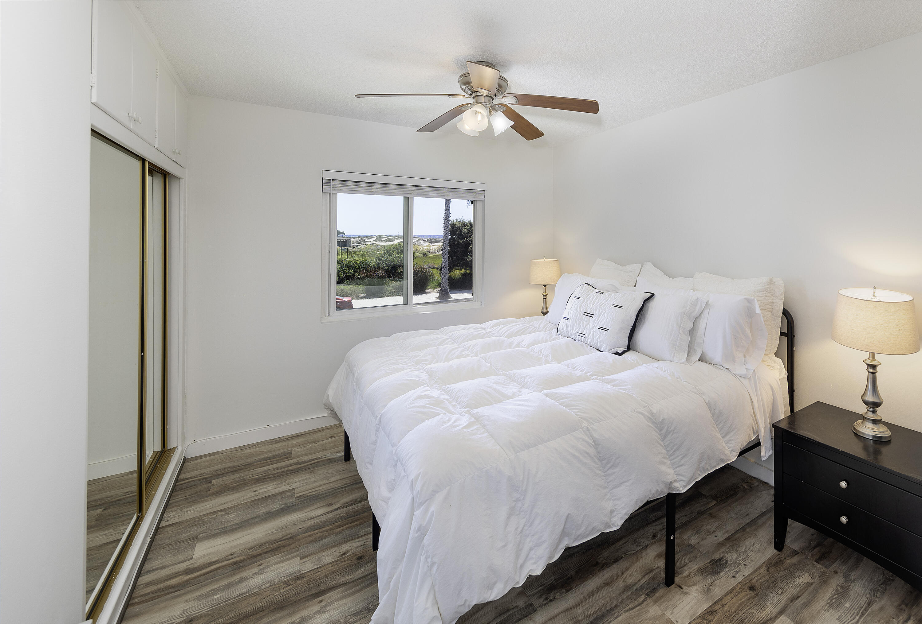 4980 Sandyland Road, Unit 203 Carpinteria, CA 93013 - Photo 5 of 23 a bedroom with a bed and window