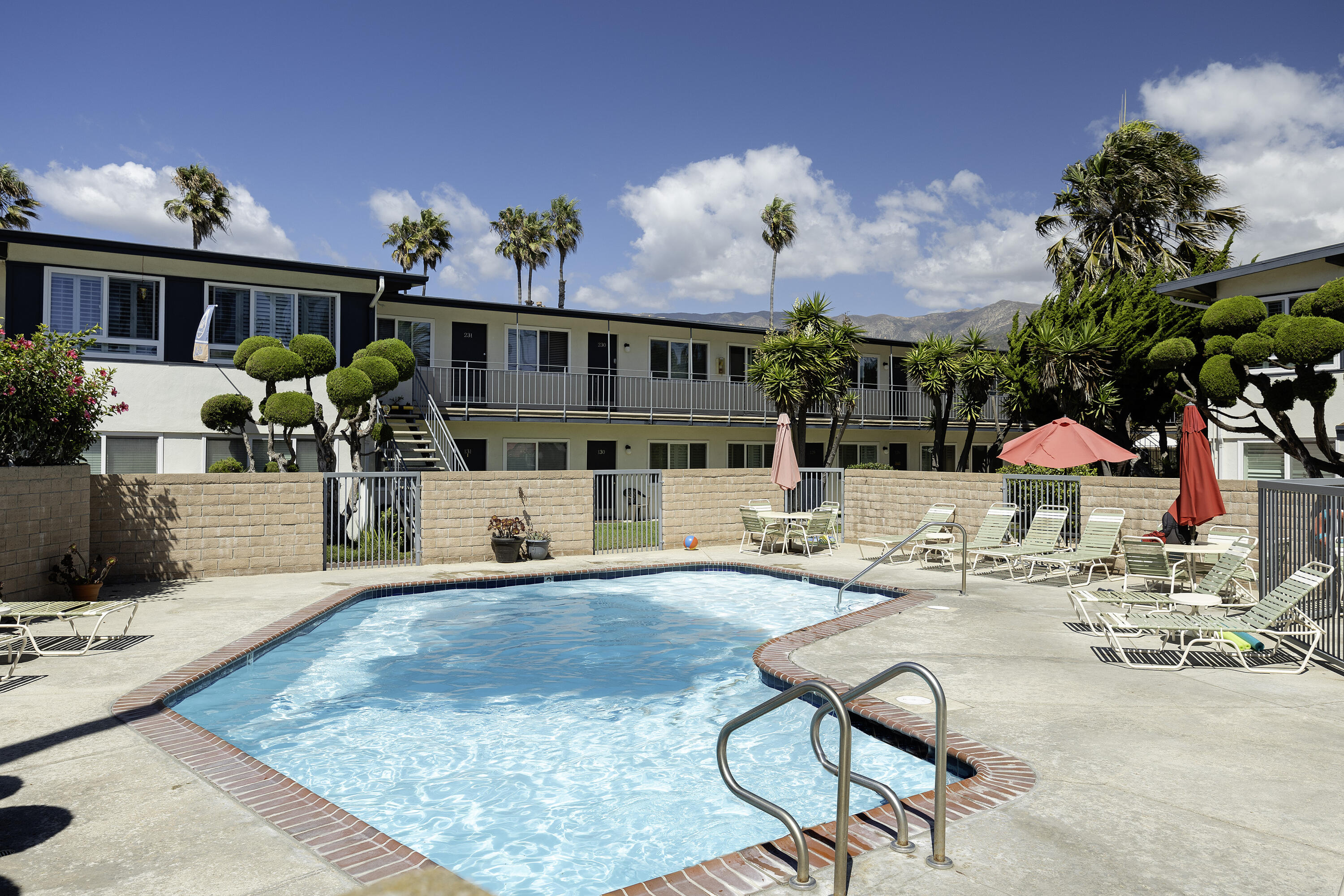 4980 Sandyland Road, Unit 203 Carpinteria, CA 93013 - Photo 10 of 23 a view of a house with swimming pool and sitting area