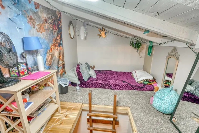 a view of balcony with furniture and wooden floor
