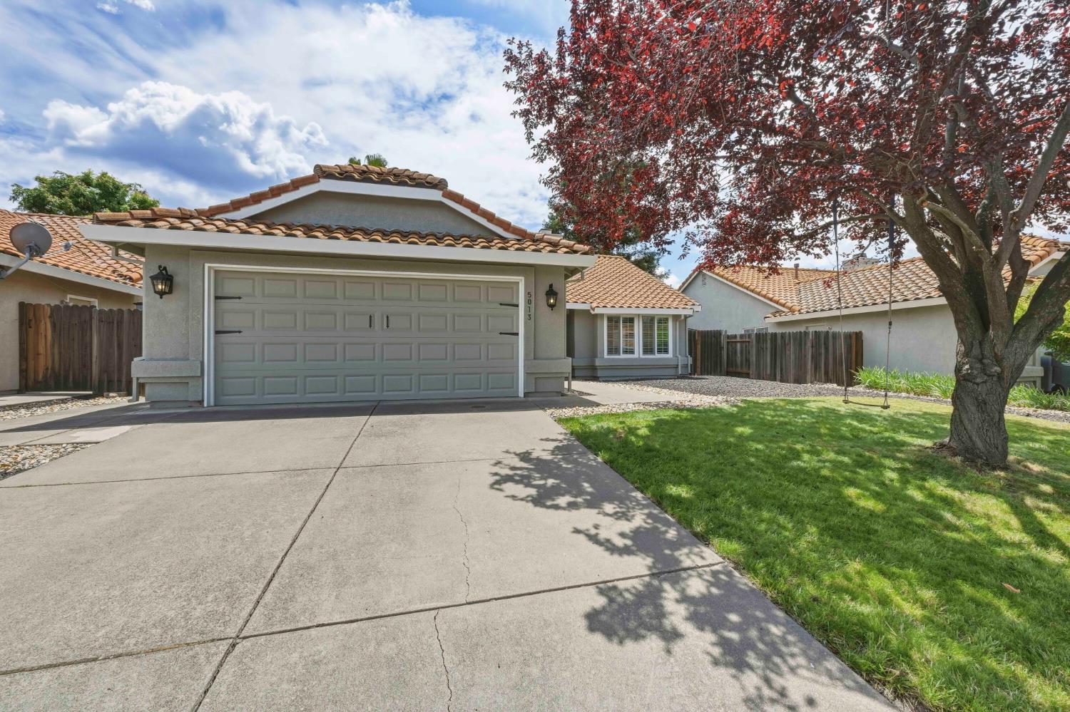 5013 Charter Road Rocklin, CA 95765 - Photo 2 of 35 a front view of a house with garden