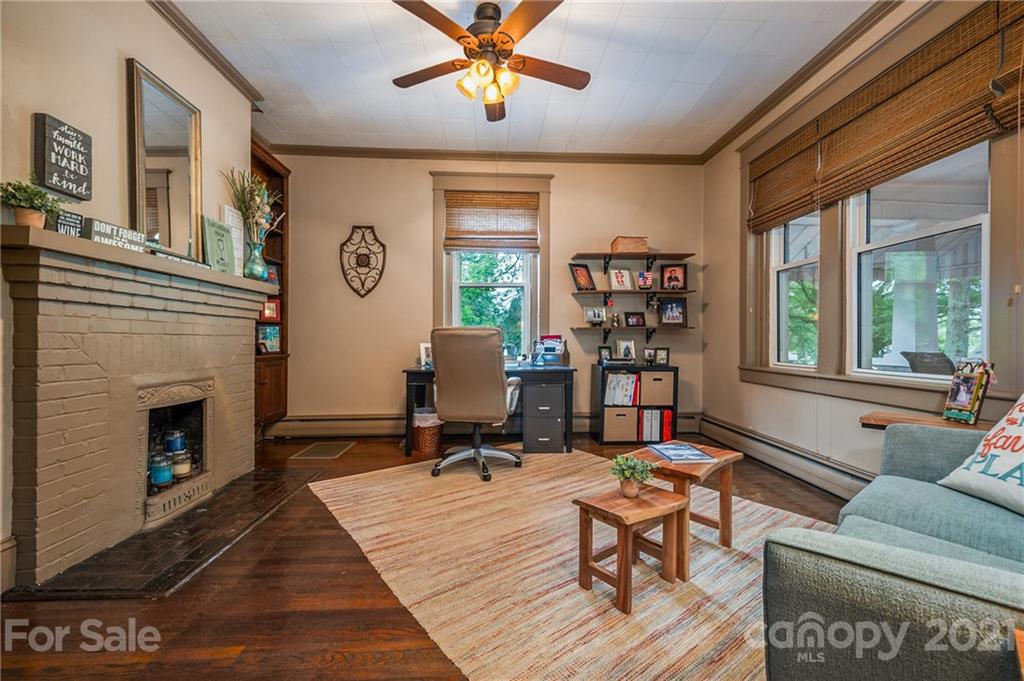 730 North Washington Street Rutherfordton, NC 28139 - Photo 22 of 48 a living room with furniture a window and a fireplace