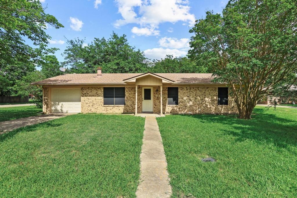 606 Hunter Street Bonham, TX 75418 - Photo 1 of 15 a front view of a house with a yard