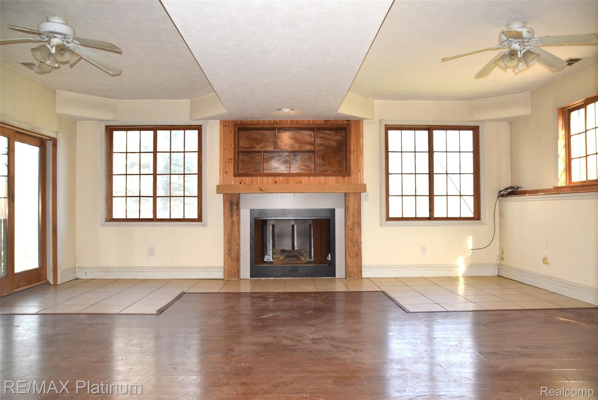 1513 East Marr Road Howell, MI 48855 - Photo 16 of 38 basement walk out fireplace lots of windows.JPG