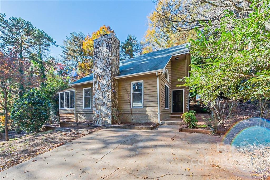 4059 Point Clear Drive Tega Cay, SC 29708 - Photo 1 of 16 a view of a house with a yard and tree