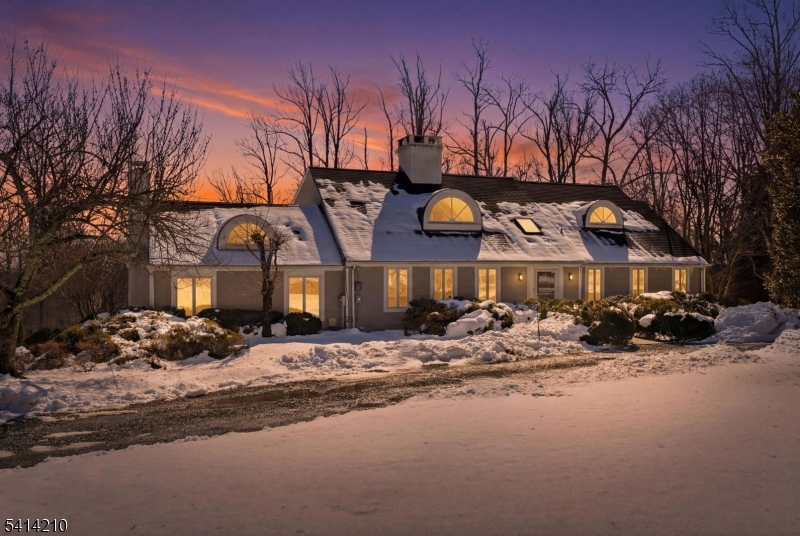 7 Post House Road Morristown, NJ 07960 - Photo 1 of 50 a front view of a house with a yard covered in snow