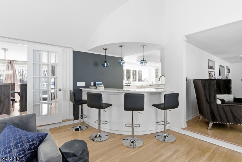 7 Post House Road Morristown, NJ 07960 - Photo 12 of 50 a dining room with wooden floor and chandelier