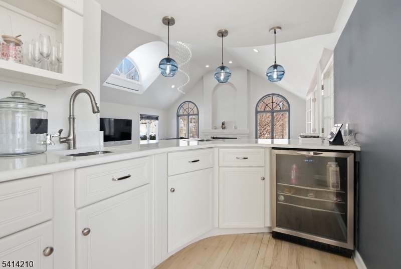 7 Post House Road Morristown, NJ 07960 - Photo 13 of 50 a kitchen with a sink dishwasher and a clock on the wall