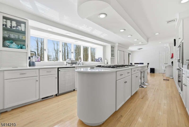 7 Post House Road Morristown, NJ 07960 - Photo 14 of 50 a kitchen with stainless steel appliances granite countertop a sink cabinets and wooden floor