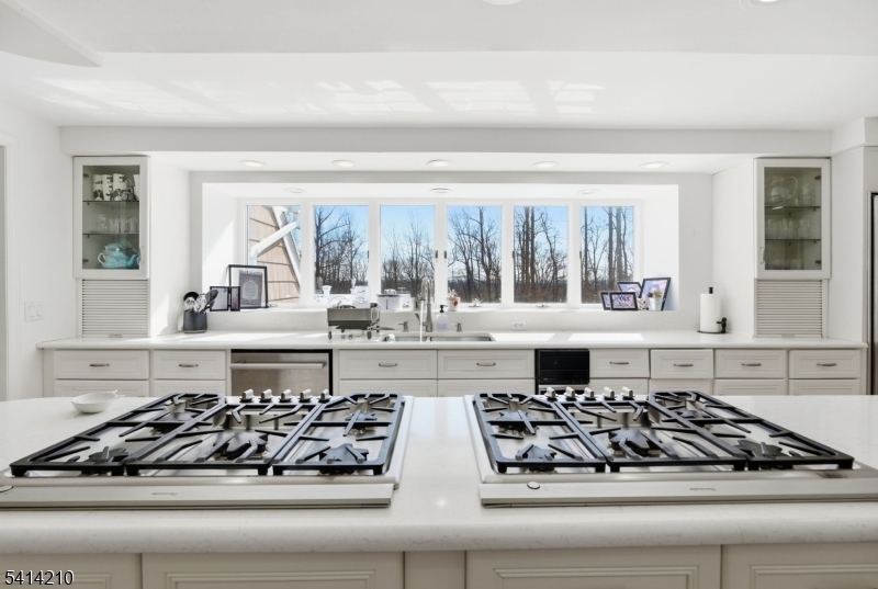 7 Post House Road Morristown, NJ 07960 - Photo 15 of 50 a kitchen with a stove a sink and a white cabinets