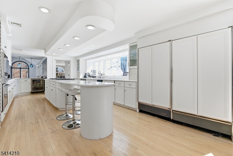 7 Post House Road Morristown, NJ 07960 - Photo 17 of 50 a living room with stainless steel appliances kitchen island granite countertop furniture and a refrigerator