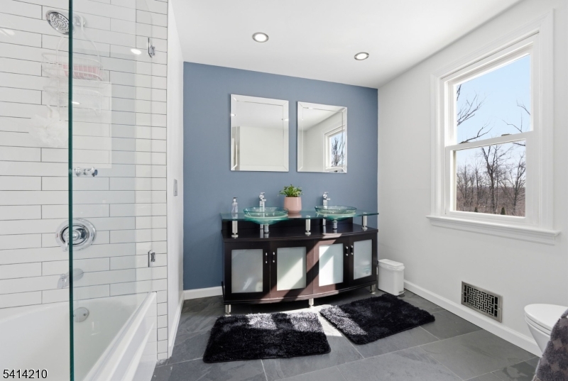 7 Post House Road Morristown, NJ 07960 - Photo 24 of 50 a view of a bathroom with a sink and a mirror
