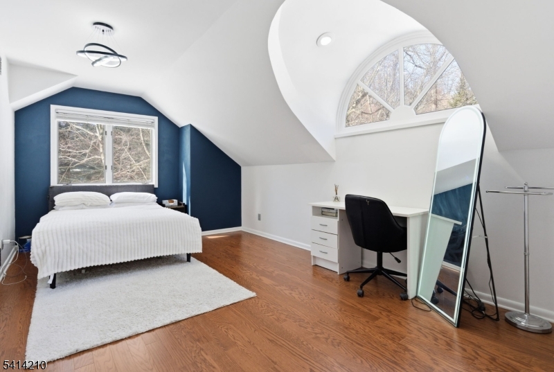 7 Post House Road Morristown, NJ 07960 - Photo 32 of 50 a bedroom with a bed and a chair