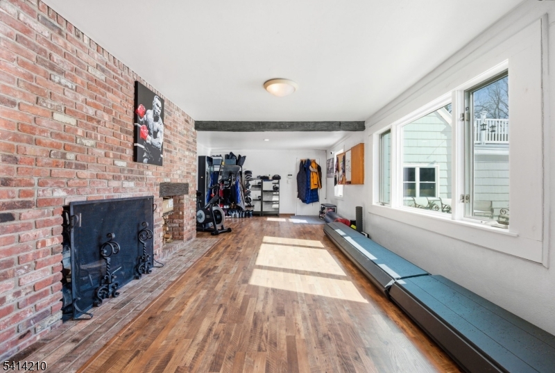 7 Post House Road Morristown, NJ 07960 - Photo 36 of 50 a living room with furniture and a fireplace