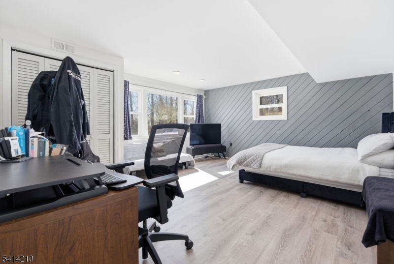 7 Post House Road Morristown, NJ 07960 - Photo 38 of 50 a bedroom with a bed window and a desk