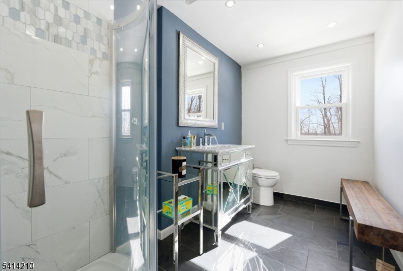 7 Post House Road Morristown, NJ 07960 - Photo 40 of 50 a bathroom with a sink mirror and toilet