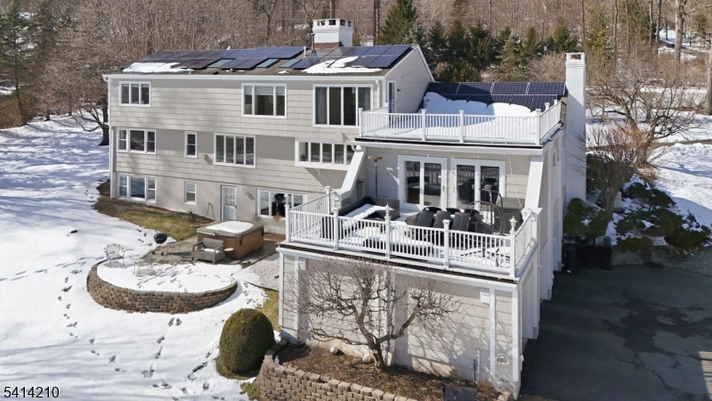 7 Post House Road Morristown, NJ 07960 - Photo 42 of 50 a front view of a house with a yard and garage