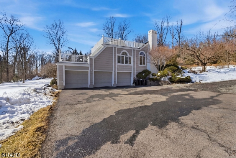 7 Post House Road Morristown, NJ 07960 - Photo 43 of 50 a front view of a house with a yard covered with snow