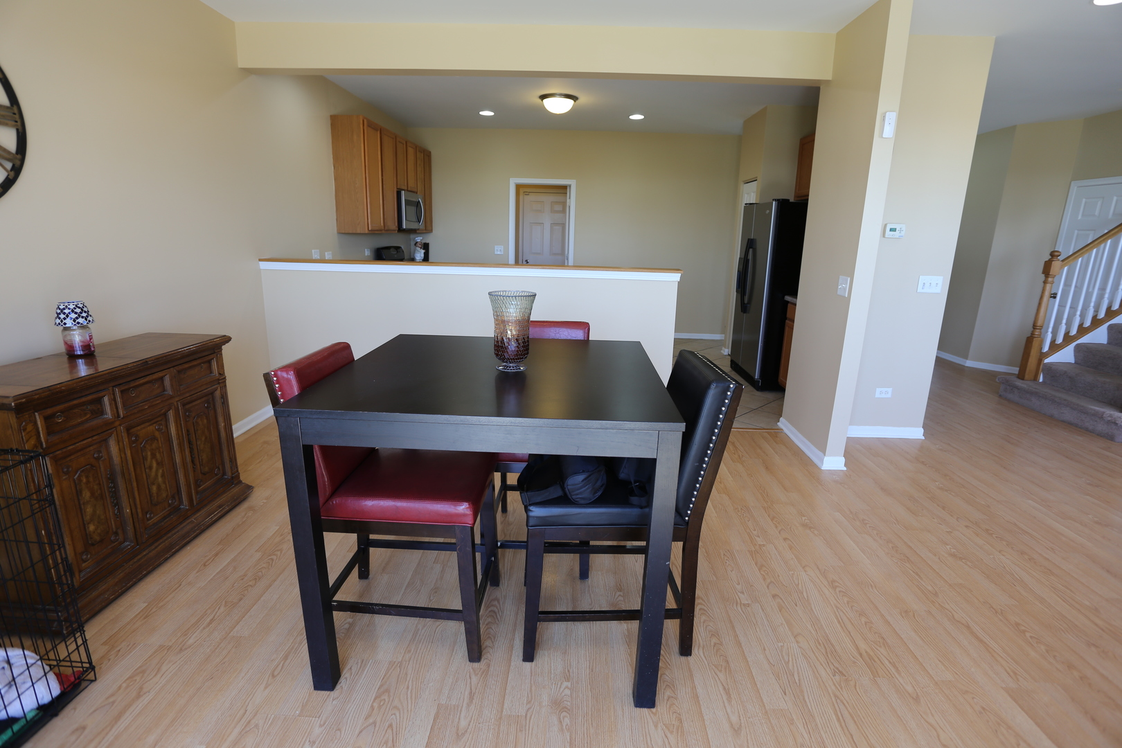 6401 Roth Court Joliet, IL 60431 - Photo 11 of 30 a view of a dining room with furniture and wooden floor