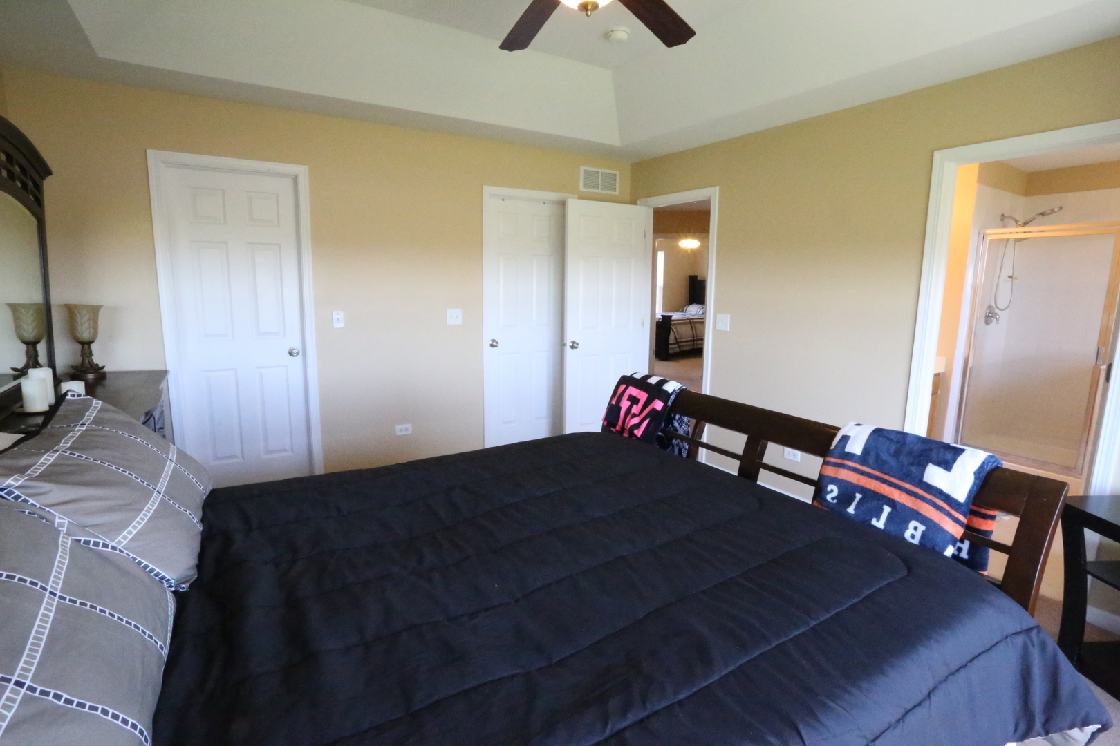 6401 Roth Court Joliet, IL 60431 - Photo 16 of 30 a bedroom with a bed and a chandelier
