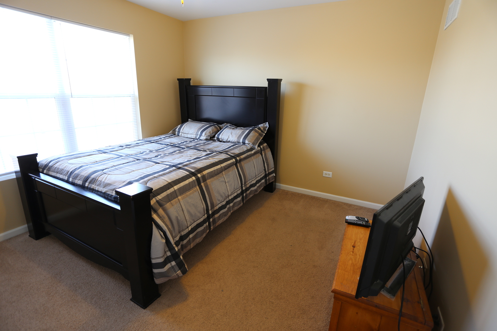 6401 Roth Court Joliet, IL 60431 - Photo 20 of 30 a bedroom with a bed and wooden floor