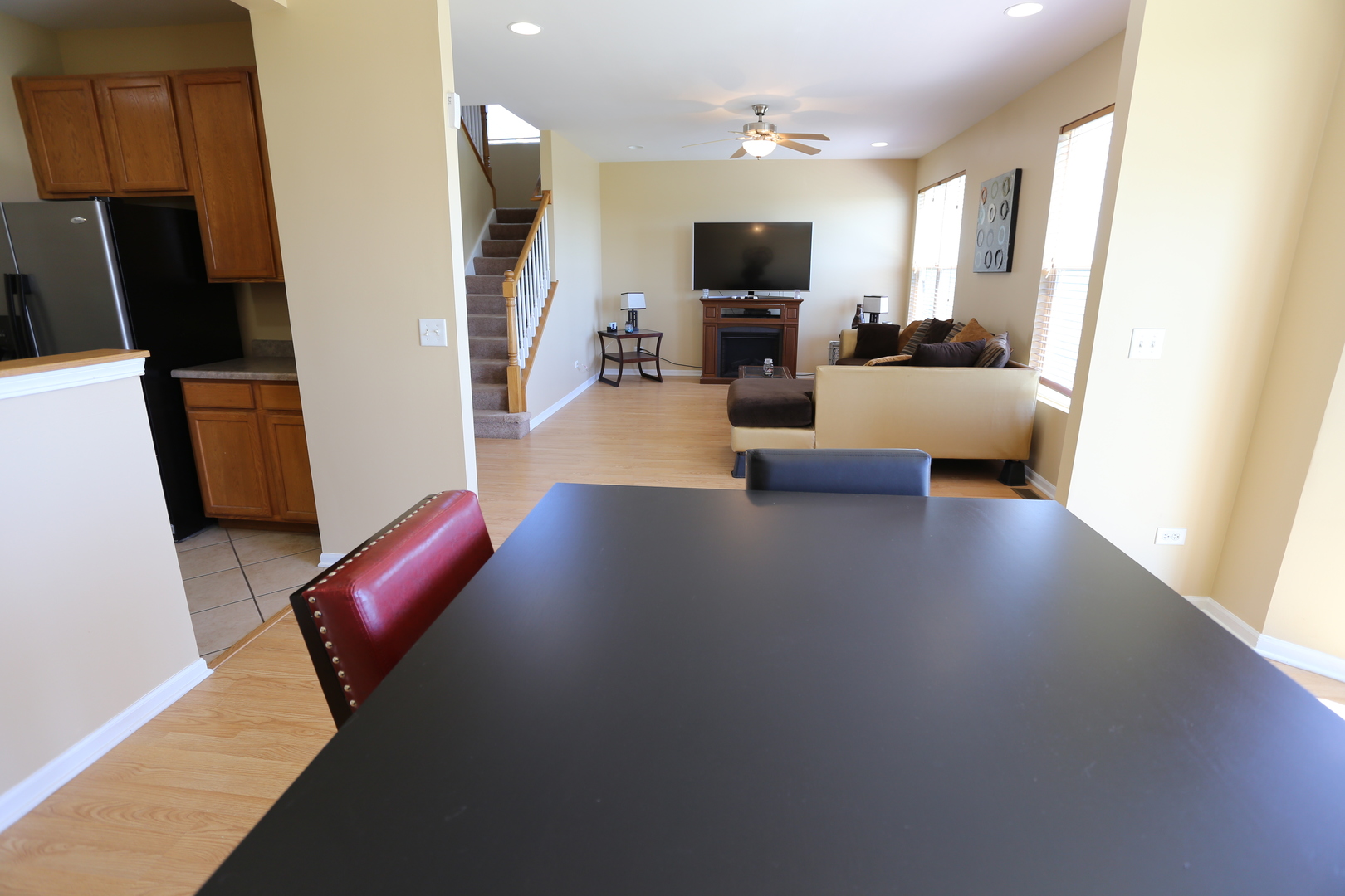 6401 Roth Court Joliet, IL 60431 - Photo 9 of 30 a living room with furniture and a flat screen tv