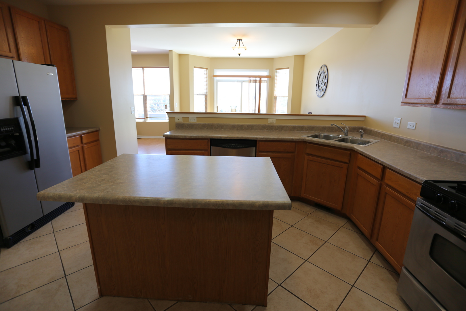 6401 Roth Court Joliet, IL 60431 - Photo 10 of 30 a kitchen with kitchen island a sink stove and refrigerator