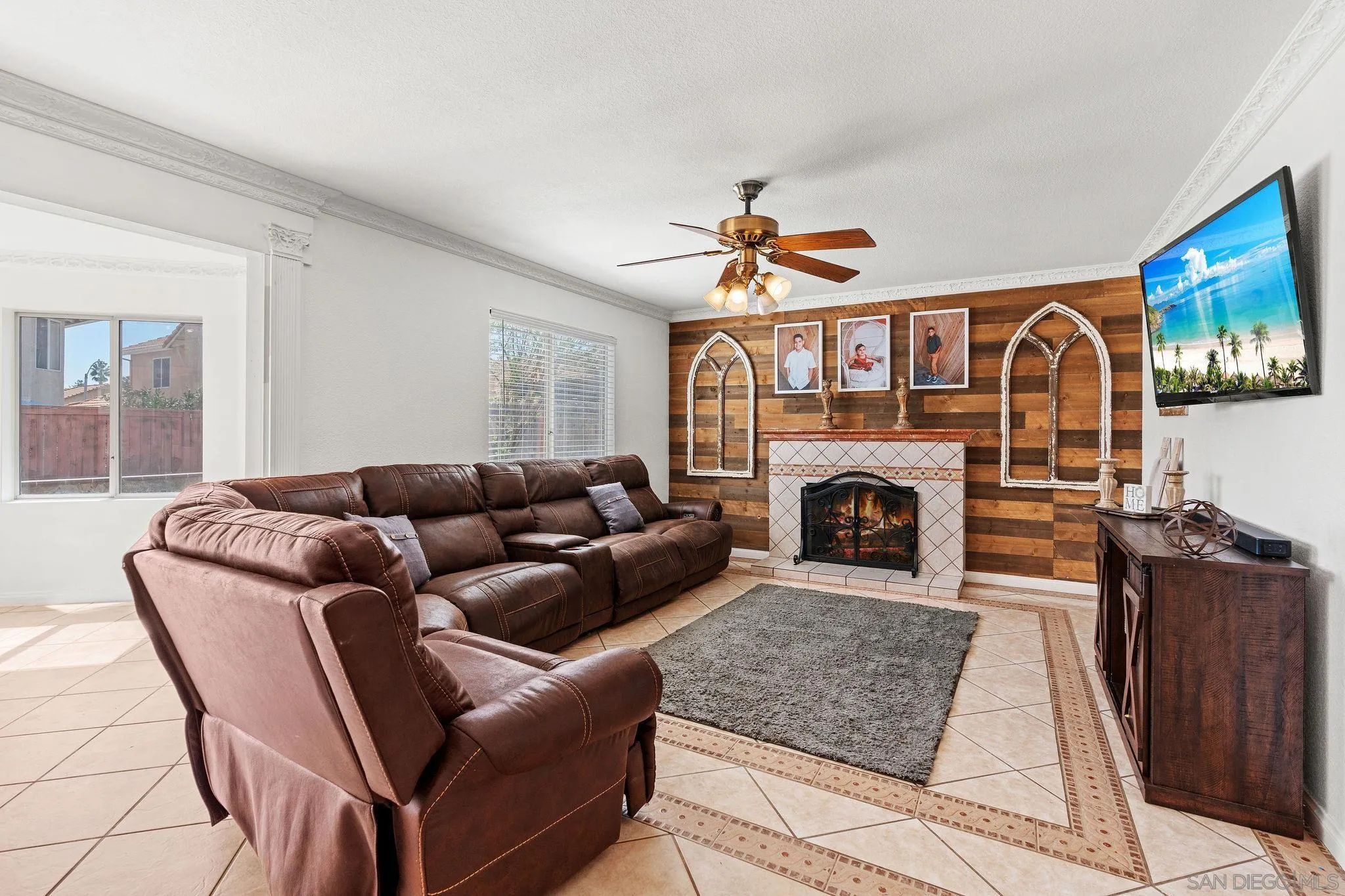 30239 Silver Ridge Court Temecula, CA 92591 - Photo 9 of 26 a living room with furniture a fireplace and a flat screen tv