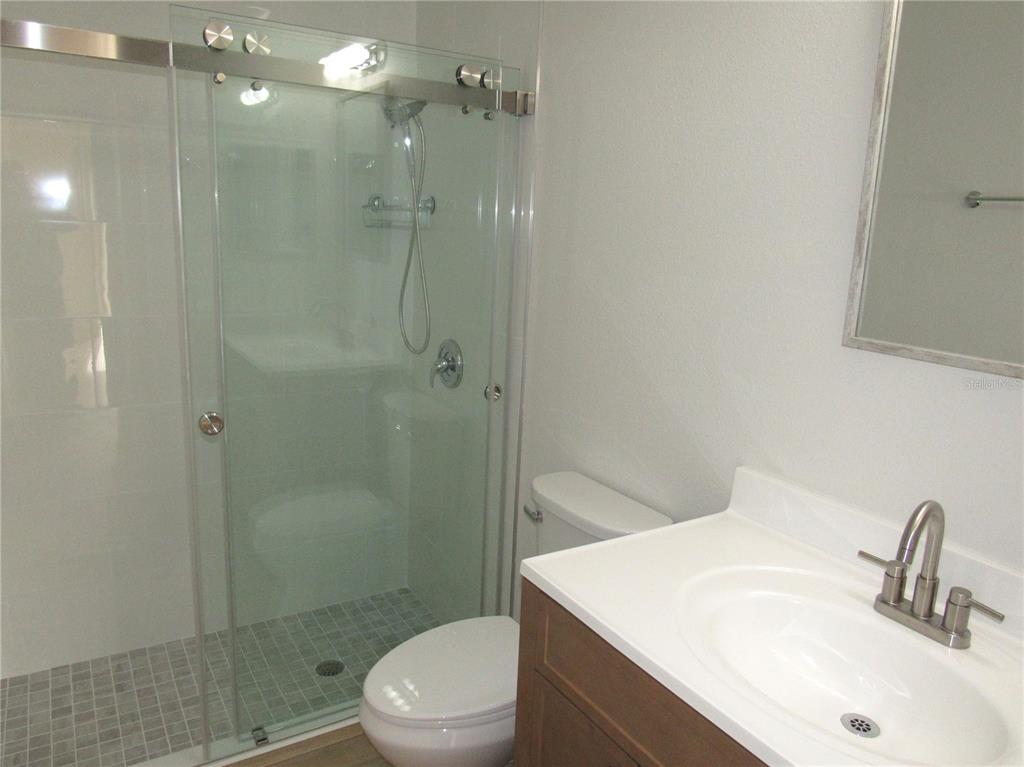 20005 Goldcup Court Port Charlotte, FL 33952 - Photo 15 of 33 a bathroom with a sink toilet and shower