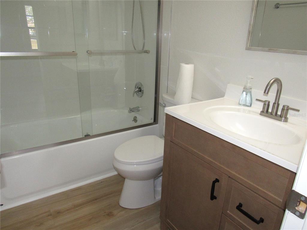 20005 Goldcup Court Port Charlotte, FL 33952 - Photo 17 of 33 a bathroom with a sink a toilet and shower