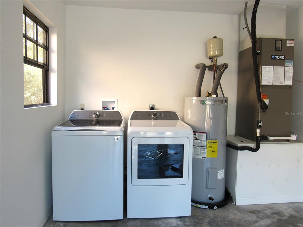 20005 Goldcup Court Port Charlotte, FL 33952 - Photo 18 of 33 a utility room with dryer and washer