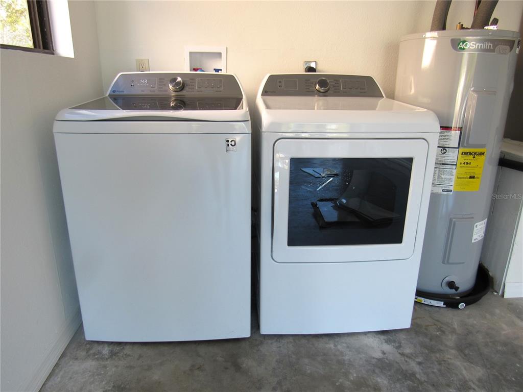 20005 Goldcup Court Port Charlotte, FL 33952 - Photo 19 of 33 a utility room with dryer and washer