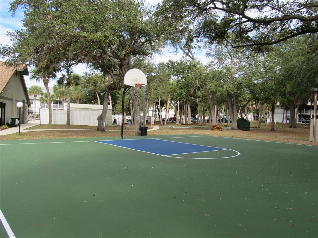 20005 Goldcup Court Port Charlotte, FL 33952 - Photo 23 of 33 a view of a playground with basketball court