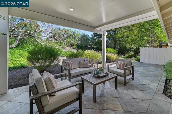 a outdoor living space with furniture and garden view