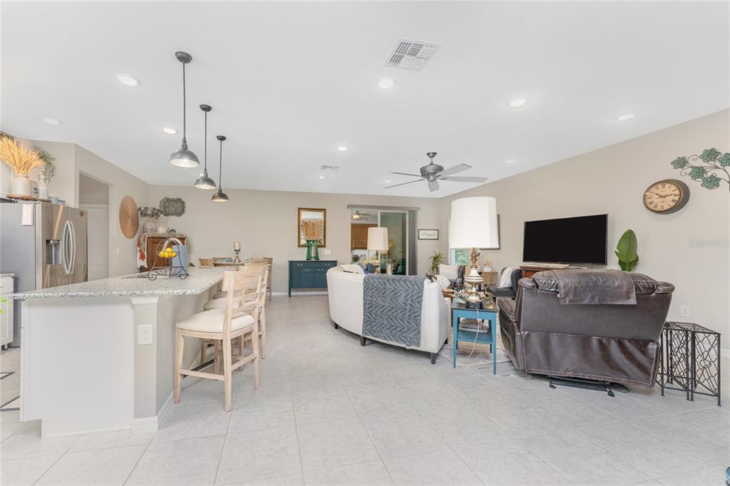 25381 Rupert Road Punta Gorda, FL 33983 - Photo 2 of 58 a living room with furniture and a flat screen tv