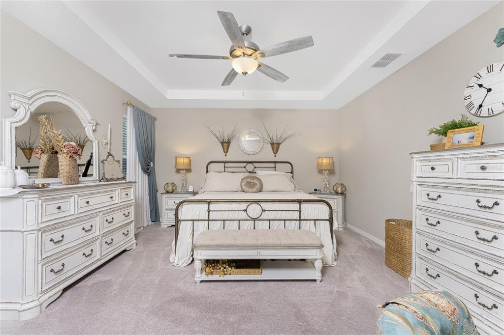 25381 Rupert Road Punta Gorda, FL 33983 - Photo 24 of 58 a bedroom with a bed and a dresser