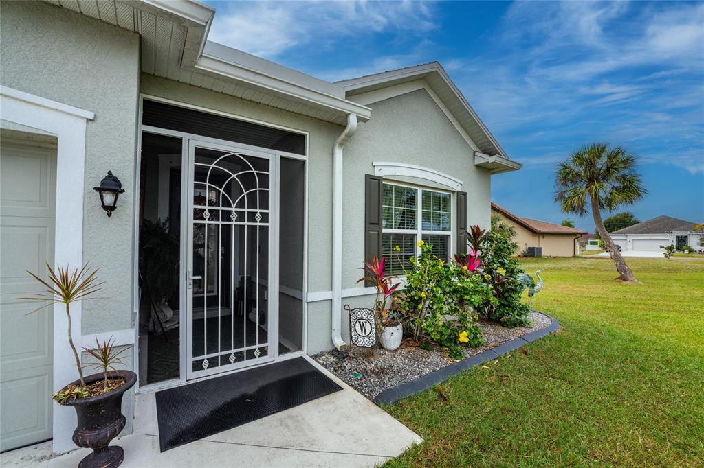 25381 Rupert Road Punta Gorda, FL 33983 - Photo 50 of 58 a front view of a house with a yard
