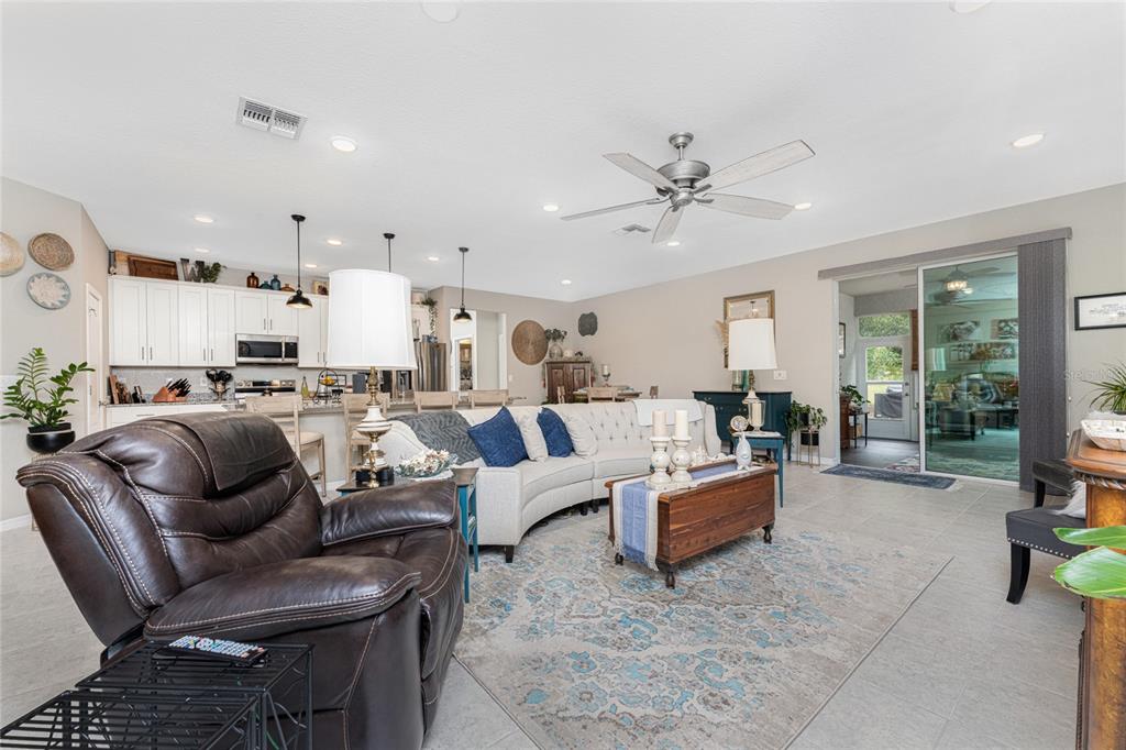 25381 Rupert Road Punta Gorda, FL 33983 - Photo 7 of 58 a living room with furniture kitchen view and a large window