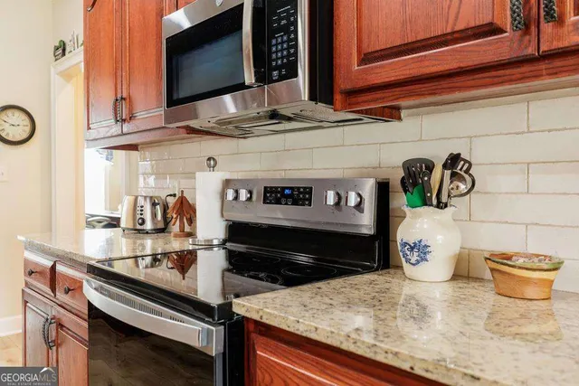 a kitchen with a stove and a microwave