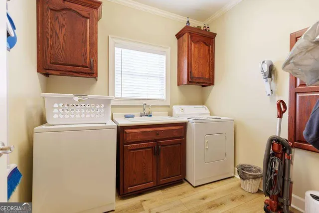 a utility room with closet dryer and washer