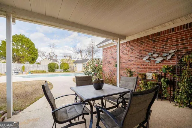 a view of an outdoor dining space with furniture