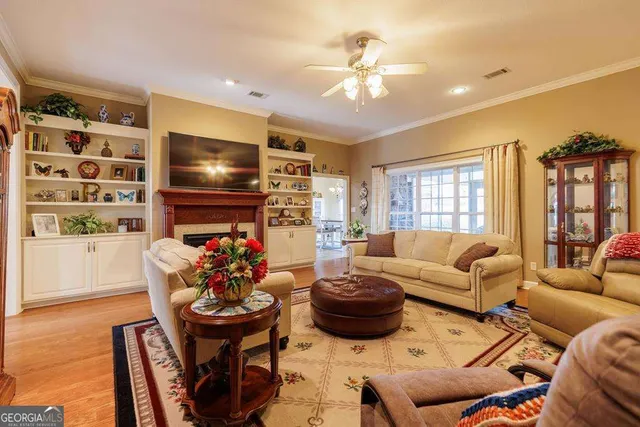 a living room with furniture fireplace and a flat screen tv