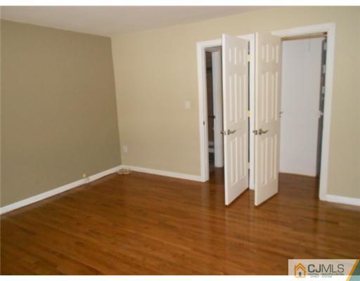 200 Portland Road, Unit D8 Highlands, NJ 07732 - Photo 9 of 10 a view of wooden floor in an empty room