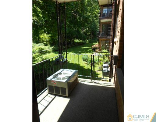 200 Portland Road, Unit D8 Highlands, NJ 07732 - Photo 10 of 10 a balcony with furniture and garden view